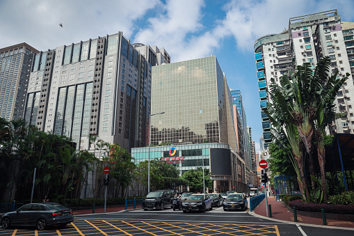 Macao, China - May 12, 2023: A bustling city street in Macau filled with towering buildings, showcasing the impressive architectural skyline of the city.