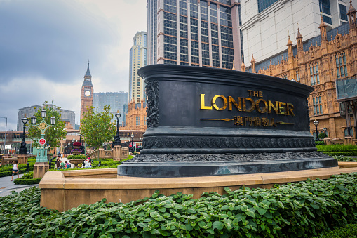 Macao, China - May 12, 2023: The iconic Londoner sign is displayed prominently amidst the bustling urban landscape of the city.