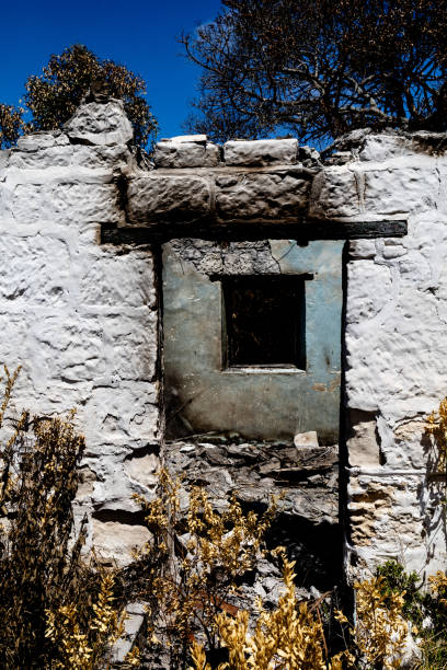View through the doorway of an old farmhouse destroyed by fire stock photo