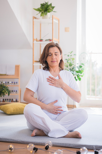 Woman exercising breathing during a yoga exercise