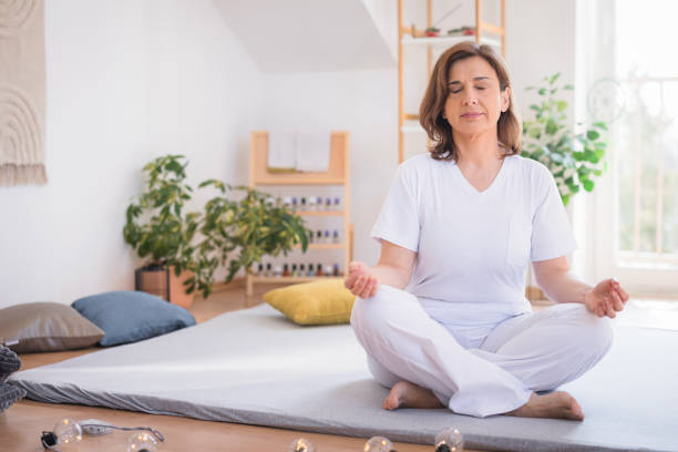 istock Woman meditating at yoga studio 2035430610