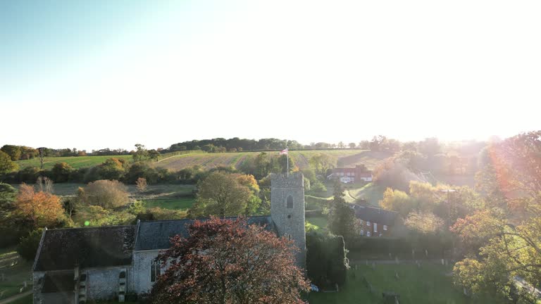 (dolly out) The Union Jack Flag on top of a Round Church Tower