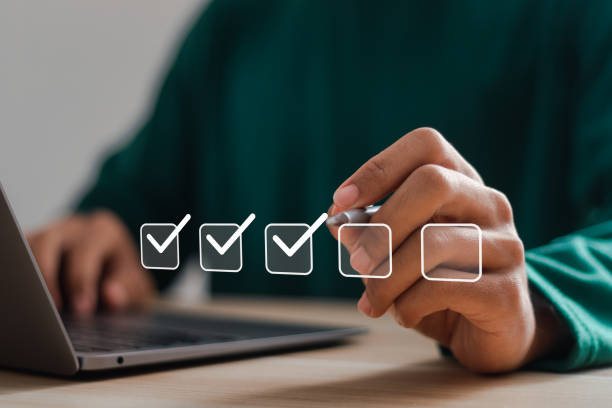 istock Checklist concept. Businessman using laptop and checking mark on checkboxes. 2035438660