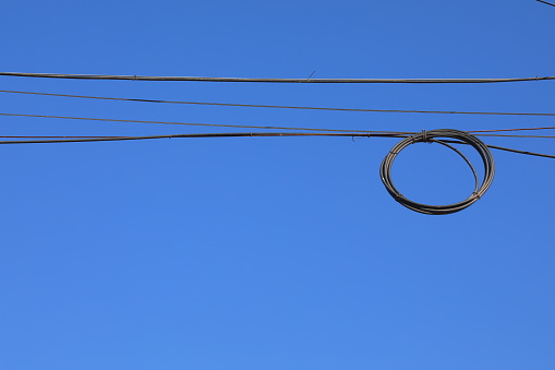 The wire coil is in the blue sky background