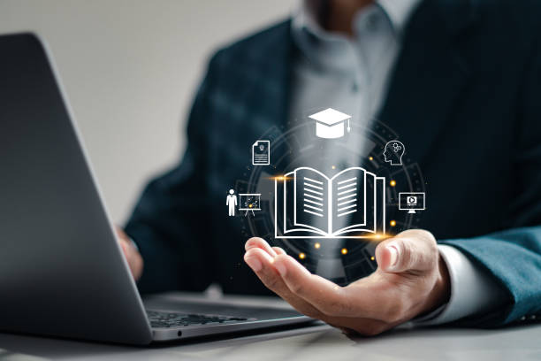 istock Online education concept, Businessman using and holding E-learning education icons for internet lessons and online webinar. Education internet technology. 2035440824