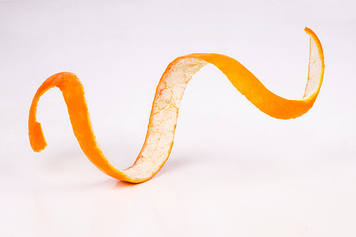 Orange zest spiral isolated on white