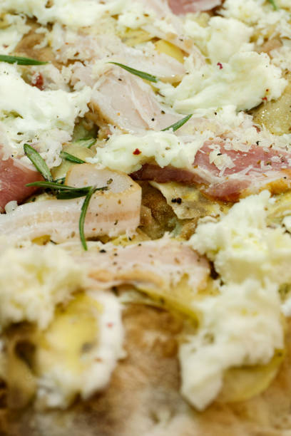 Traditional pizza with smoked bacon and mozzarella topping, abstract food background