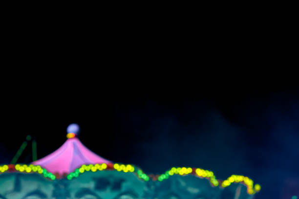 istock Old fashioned carousel in amusement park. 2035474299