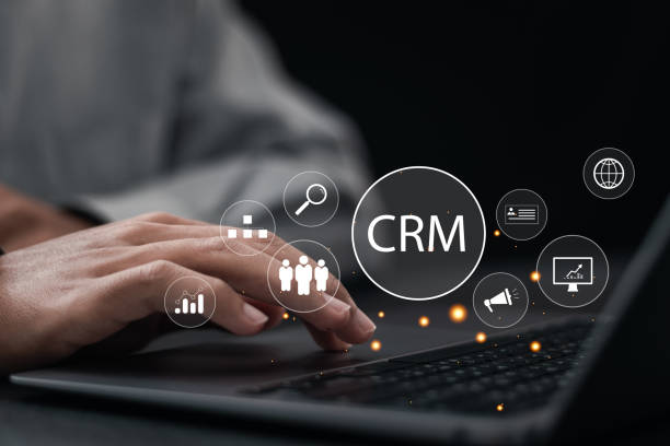 istock CRM Customer Relationship Management concept. businessman use laptop with customer network management and development of customer information exchange, social media, digital online. 2035476325