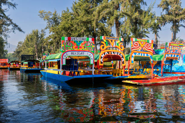 Trajineras at Xochimilco Lake Popular Trajineras at Xochimilco lake in Mexico's valley trajinera stock pictures, royalty-free photos & images