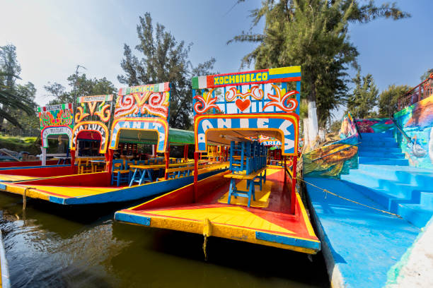 Trajineras at Xochimilco Lake Popular Trajineras at Xochimilco lake in Mexico's valley trajinera stock pictures, royalty-free photos & images