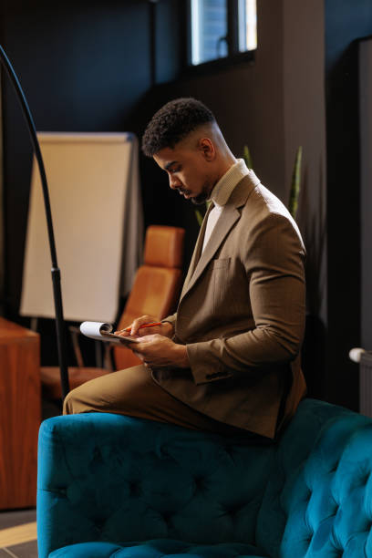 istock Businessman going through paper work at the office 2035499642