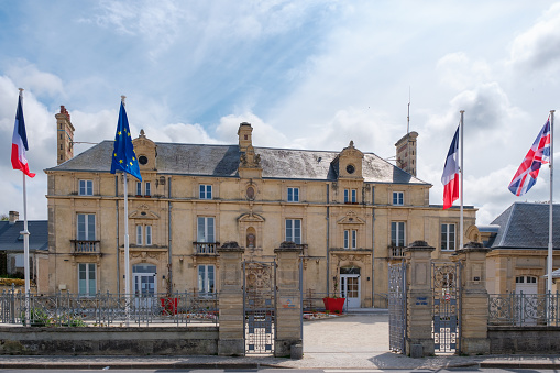 townhall (Hotel de Ville) with flags in Lion-sur-Mer, Normandy, France
