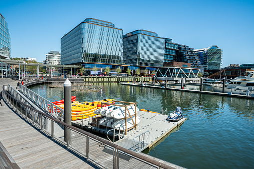 WASHINGTON D.C., USA - April 9, 2023 :   Kayaks and paddleboards rental at recreation pier in the Wharf, modern mixed-use development on the Southwest Waterfront in Washington, D.C.
