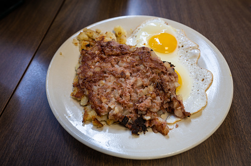 Corned beef hash with fried eggs sunny side up