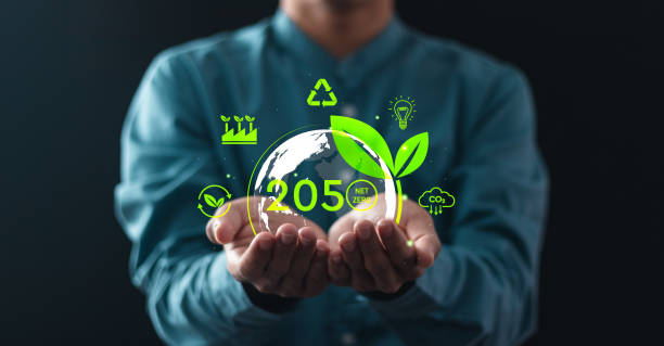 istock Net zero emissions by 2050. Businessman holding virtual globe with Net Zero icons to change climate and net zero greenhouse gas emissions target. Sustainable development and green business concept. 2035521035