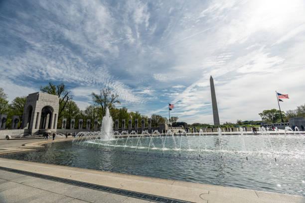 view of washington monument and  world war ii memorial in beautiful sunny day, washington d.c. usa - veteran world war ii armed forces military fotografías e imágenes de stock