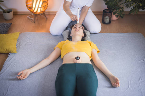 istock Woman having alternative medicine headache remedy 2035529423