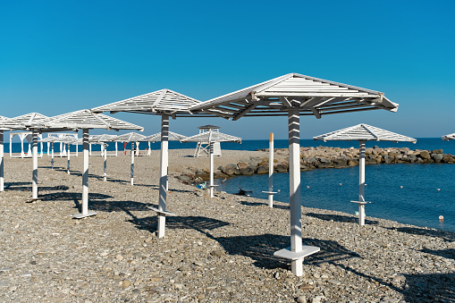 Beach umbrellas in the resort village of Nebug, Krasnodar Territory, Russia.