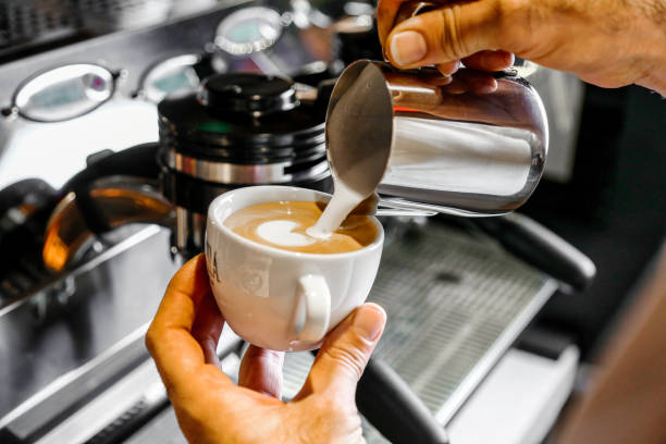 istock Person Pouring Freshly Brewed Coffee Into a Ceramic Cup 2035558289