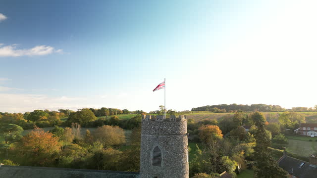 (dolly out) The Union Jack Flag on top of a Round Church Tower