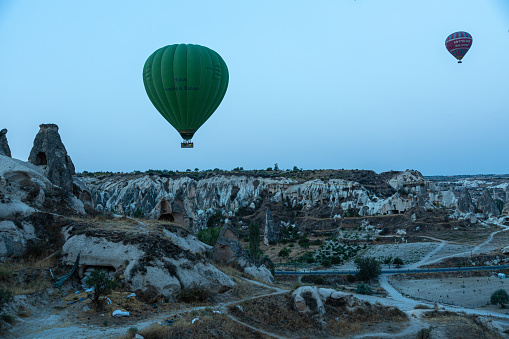 Cappadocia/Turkey - September 16 2017: Hot air balloon morning fly over the rocks