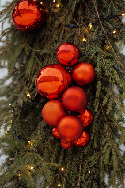 istock Christmas garland with red ornaments on door. 2035603211