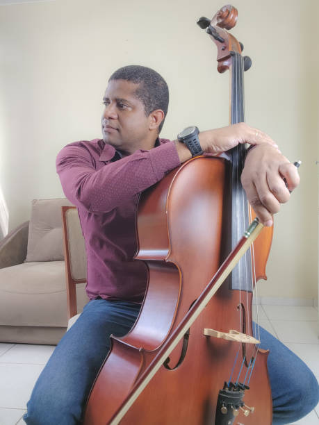 istock Music student playing cello and guitar instrument 2035615220