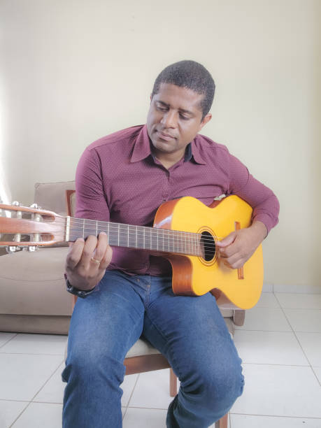 istock Music student playing cello and guitar instrument 2035615223