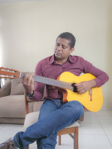 istock Music student playing cello and guitar instrument 2035615740