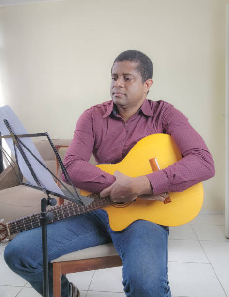 istock Music student playing cello and guitar instrument 2035615746