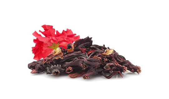 Heap of dried Hibiscus flowers for hot or cold herbal tea. Isolated on white background.