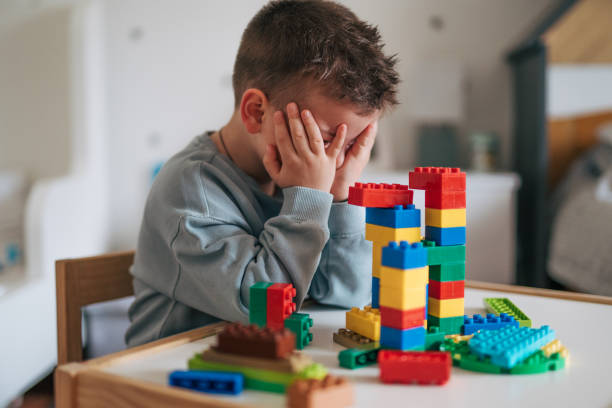 istock A little boy in a sad mood. 2035699649