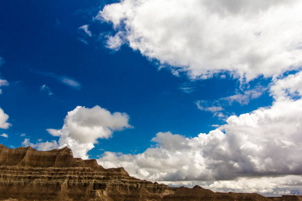 Badlands National Park (Lakota: Makȟóšiča[3]) is an American national park located in southwestern South Dakota. The park protects 242,756 acres (379.3 sq mi; 982.4 km2)[1] of sharply eroded buttes and pinnacles, along with the largest undisturbed mixed grass prairie in the United States. The National Park Service manages the park, with the South Unit being co-managed with the Oglala Lakota tribe.[4]In the heart of sparsely setteled region, far from major sources of industrial pollution. Badlands National Park offers clean air and haze free views, most of the time. On a clear day, you can see Eagle nestButte, thirty miles away. On a clear night you can see a wealth of distant stars, trillions miles away. But all too often, Polluted air flows in from, industrial areas as far away as Southern California, Arizona, Midwest and mask of pollution veils the badlands.