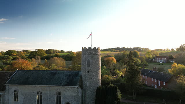 (dolly in) The Union Jack Flag on top of a Round Church Tower