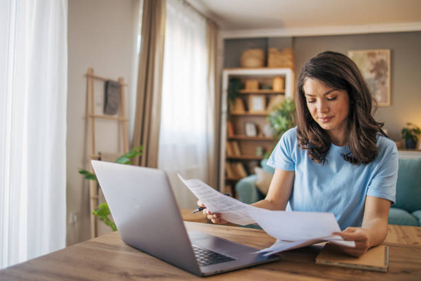 istock Adult woman analyzing bills. 2035787295