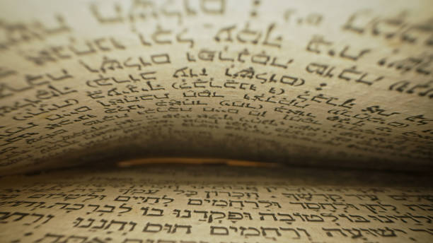 istock Hebrew Bible. Exploring sacred jewish heritage scriptures. Revered texts in macro. Holy pages, old religious Torah book. 2035806465