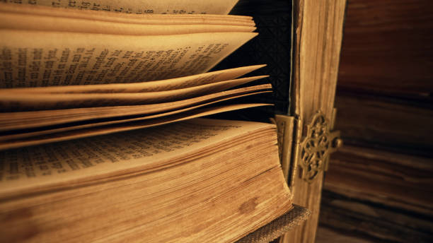 istock Opened saved medieval book with ancient writings. Religious literature, archival manuscripts, rare collection tomes, artifacts. 2035806469