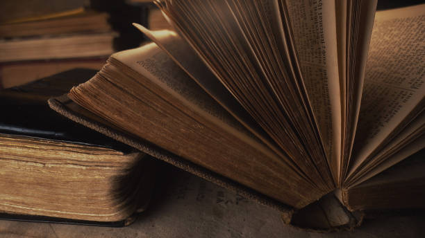 istock Opened saved medieval book with ancient writings. Religious literature, archival manuscripts, rare collection tomes, artifacts. 2035806473