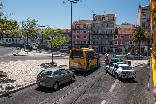 Lisbon, Portugal - July 24 2016: Traffic in old streets of Lisbon.