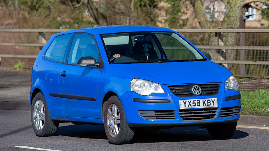 Milton Keynes,UK-Feb 24th 2024: 2008 blue Volkswagen Polo car driving on an English road