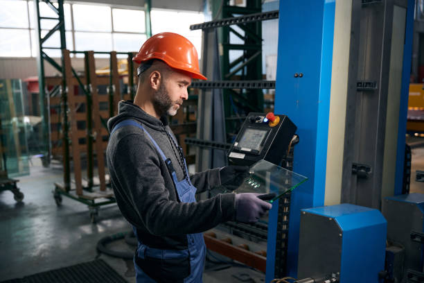 istock Employee holds in his hands drilled glass for double-glazed window 2035857205