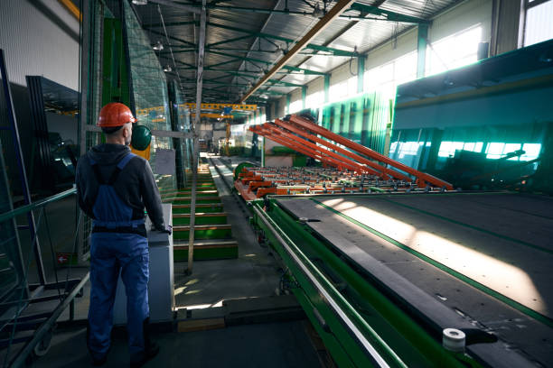 istock Worker uses modern equipment to work with glass 2035857748