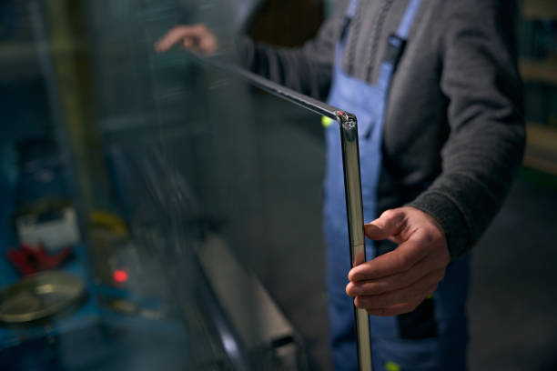istock Worker at window production carries out initial sealing spacer frame 2035858305