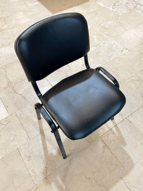istock Leather chair on ceramics tiled floor 2035862603