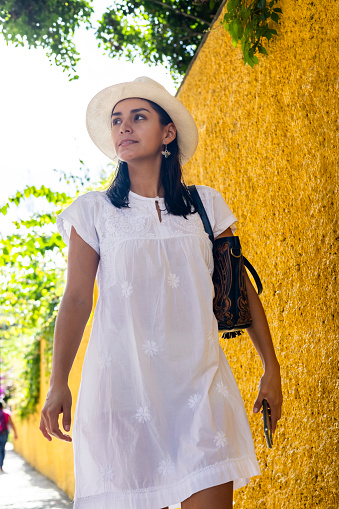 Beautiful woman walking on the most colorful and importan streets of San Miguel de Allende