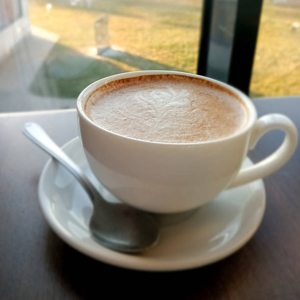 istock cappuccino with cinnamon in a cup on the table 2035884156