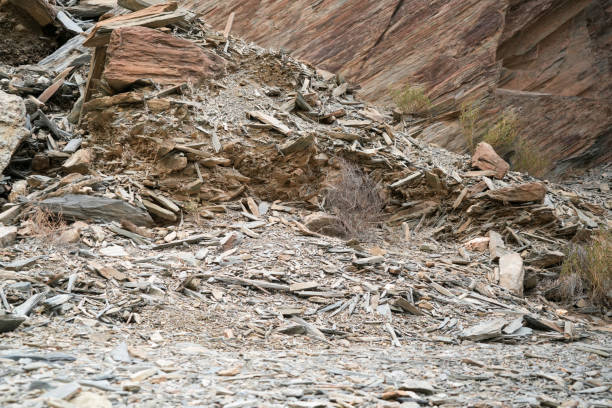 decaying rock like pieces of stone wood on sandstone cliff near main road in Wadi Bani Awf, Oman. Nice for background.