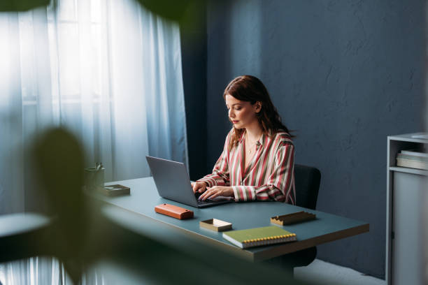 istock Professional Woman Concentrated on Work at Modern Home Office 2035915071