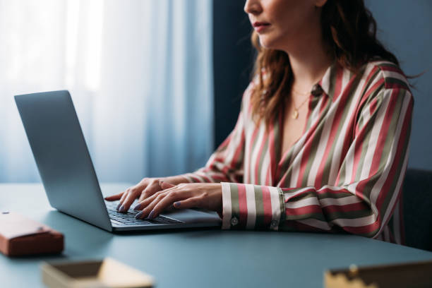 istock Professional Woman Working on Laptop at Modern Home Office 2035915076